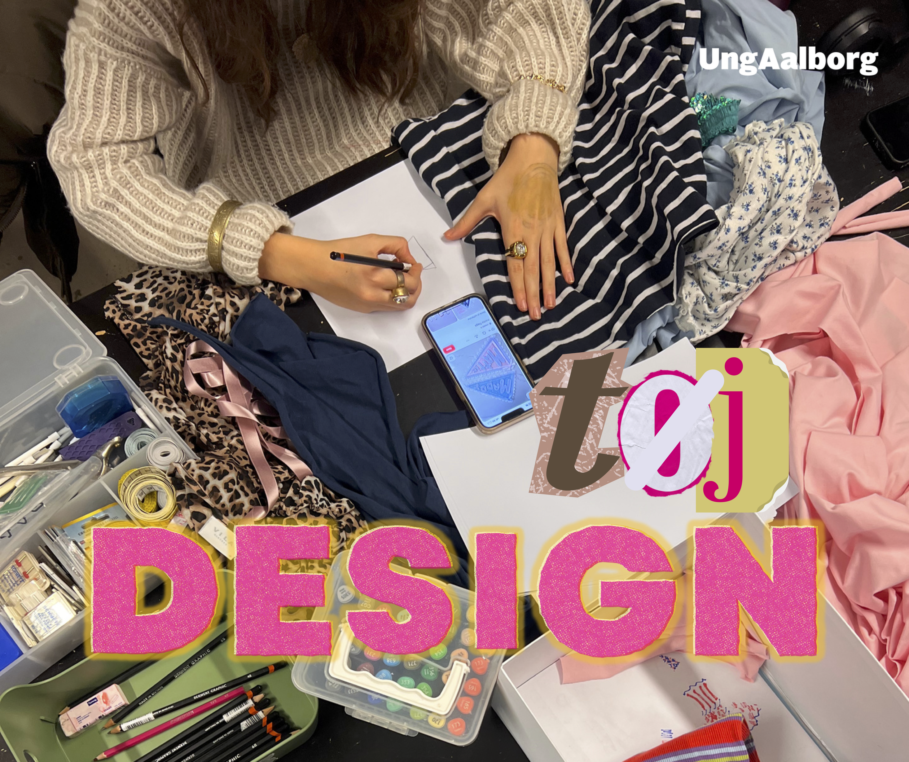 På billedet ses en af pigerne på designholdet, imens hun sidder og skitser hendes næste projekt omringet af stof og sy-grej.